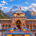 Badrinath Dham Temple in Uttarakhand surrounded by snow-covered Himalayan mountains at golden hour, with pilgrims visiting the colourful temple and Maharashtra Views logo in the top-left corner.
