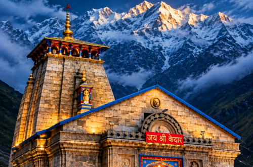 Kedarnath Temple at dusk with snow-covered Himalayan peaks