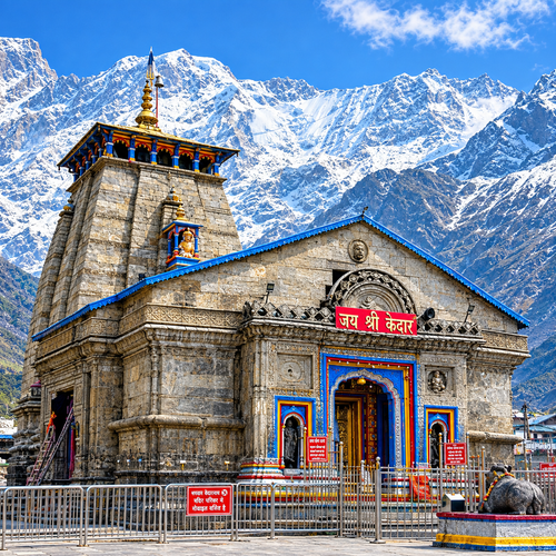 Kedarnath Temple surrounded by snow-covered Himalayan mountains