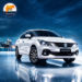 White Maruti Suzuki Baleno on a wet reflective surface at night, with a city skyline in the background and the Maharashtra Views logo in the upper-left corner.