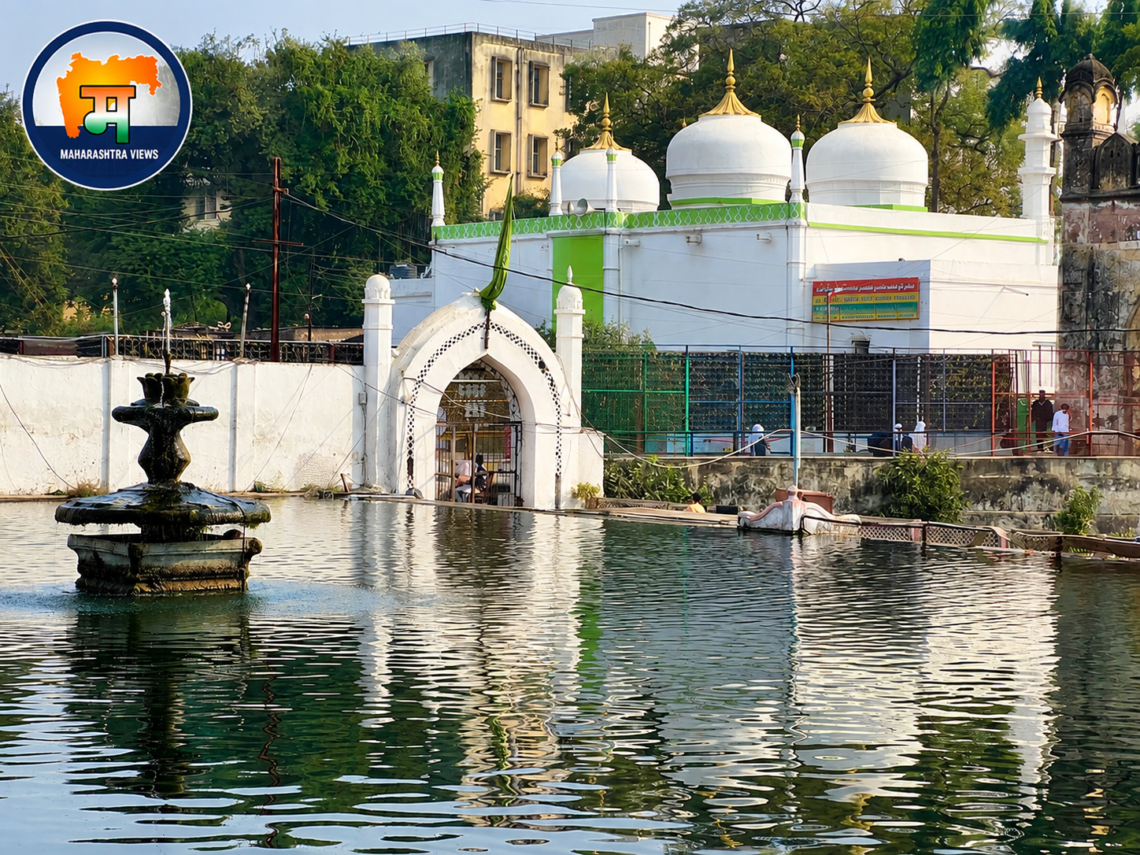 Panchakki in Aurangabad (Chhatrapati Sambhajinagar), Maharashtra, showing the historic water fountain, reflective water tank, and white-domed Dargah.