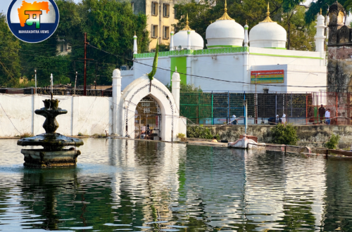 Panchakki in Aurangabad (Chhatrapati Sambhajinagar), Maharashtra, showing the historic water fountain, reflective water tank, and white-domed Dargah.