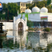 Panchakki in Aurangabad (Chhatrapati Sambhajinagar), Maharashtra, showing the historic water fountain, reflective water tank, and white-domed Dargah.