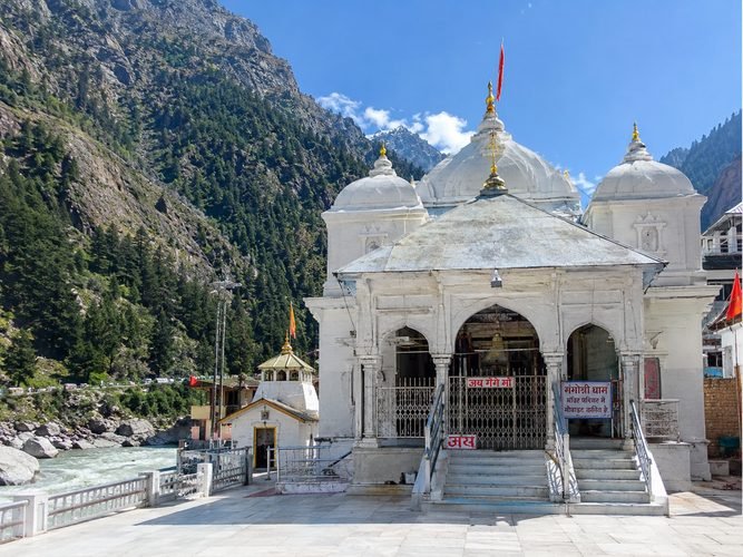 White granite architecture of Gangotri temple with Himalayan backdrop