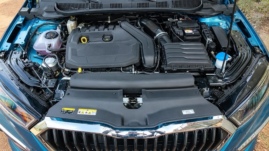 Open bonnet of the 2026 Slavia facelift showing the 1.5L TSI petrol engine under a black cover